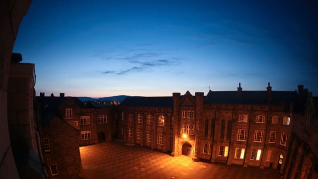Inner courtyard of a European boarding school at dusk
