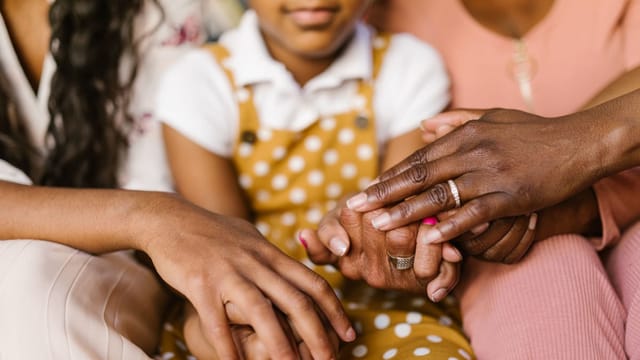 Hands of people from different backgrounds joined together