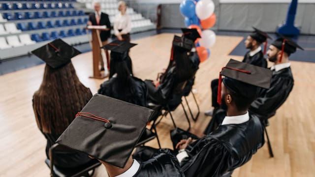 Graduates throwing their caps at a graduation ceremony