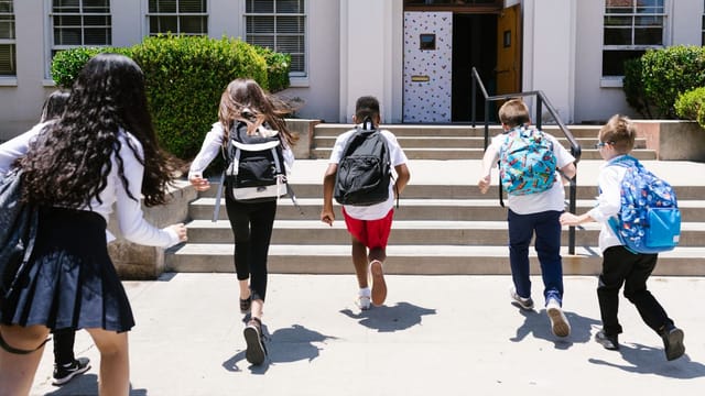 Students at the entrance of a school