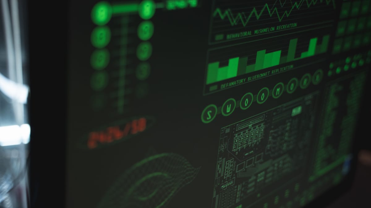 Data scientist analysing data on screen