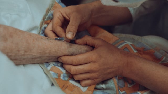 Nurse caring for a patient in hospital