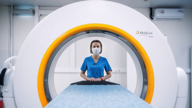 Radiographer at a medical imaging scanner