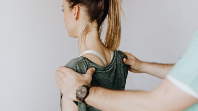 Osteopath treating a patient