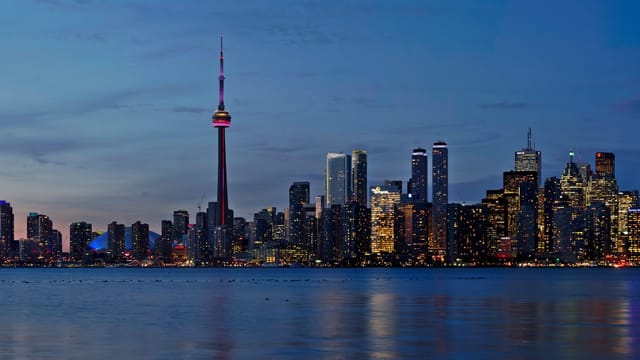 The CN Tower and the Toronto skyline at dusk, seen from Lake Ontario