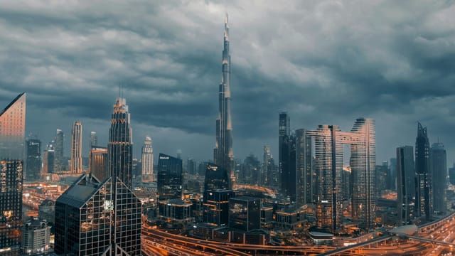 The Dubai skyline with the Burj Khalifa under a stormy sky