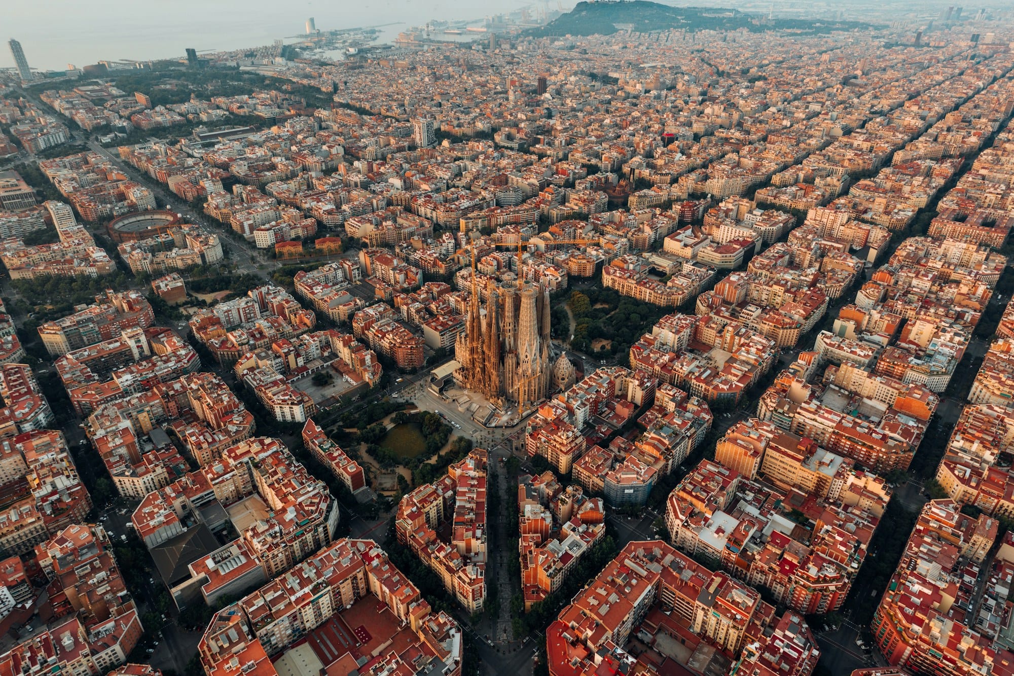 Aerial view of Barcelona with the Sagrada Família at the heart of the Eixample