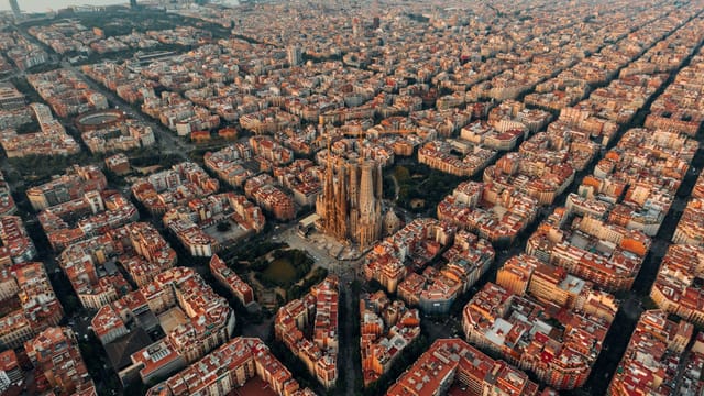 Aerial view of Barcelona with the Sagrada Família at the heart of the Eixample