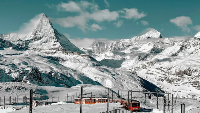 The snow-covered Matterhorn and the Gornergrat railway near Zermatt
